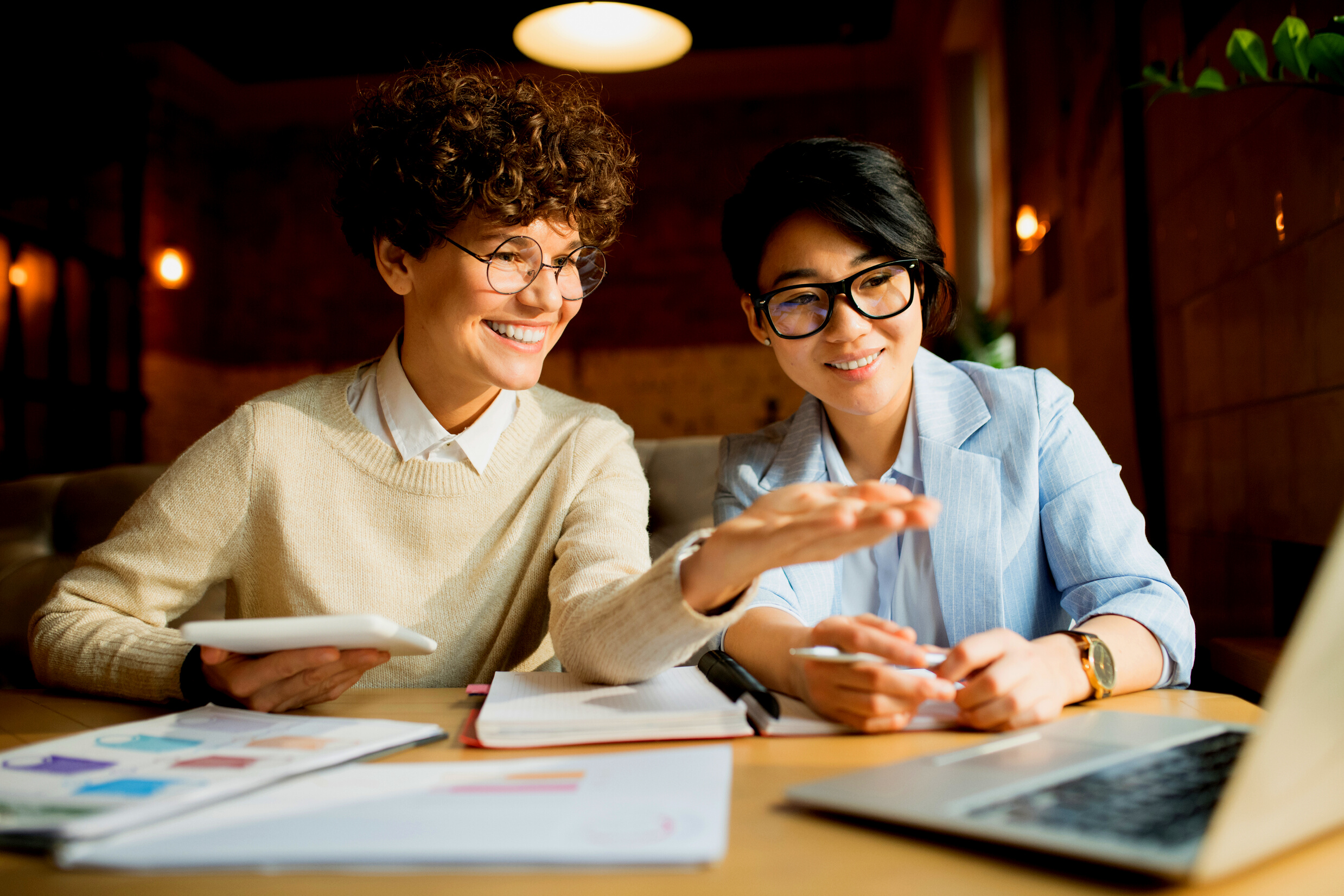 Cheerful marketing team analyzing information